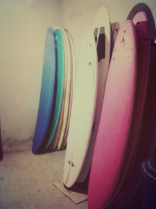 stored away surfboards in a surf camps basement