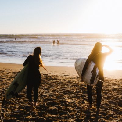 Girls on the beach at the sunset.